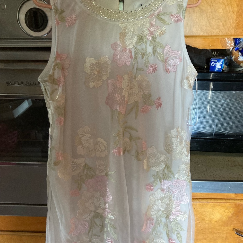 White SD collection neckline with pearl and rindstones.